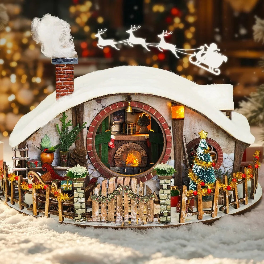Maison Miniature Magic Ring Snow House dans un décor de Noël enneigé